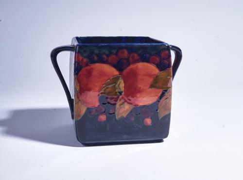 A MOOCROFT POTTERY TWO-HANDLED BISCUIT JAR