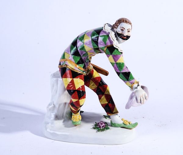A MEISSEN FIGURE OF THE GREETING HARLEQUIN