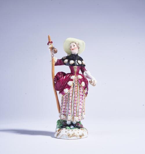 A MEISSEN FIGURE OF A FEMALE PILGRIM