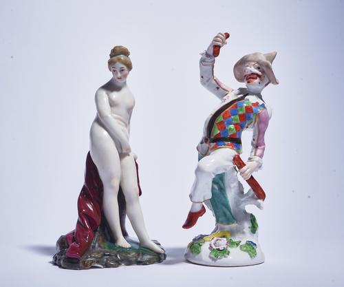 A GERMAN PORCELAIN FIGURE OF PULCINELLA (2)