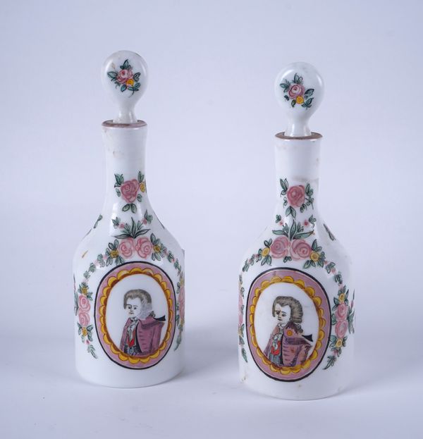 A PAIR OF BOHEMIAN MILCHGLAS DECANTERS AND STOPPERS (4)