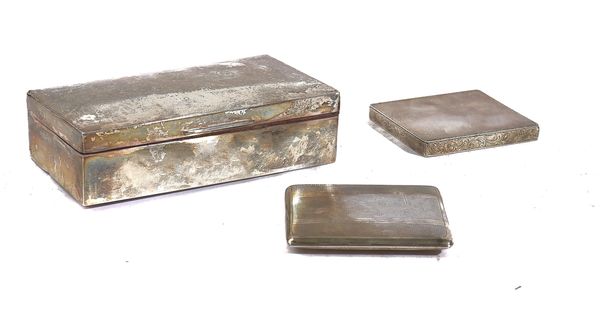 A SILVER TABLE CIGARETTE BOX AND TWO SILVER CIGARETTE CASES (3)