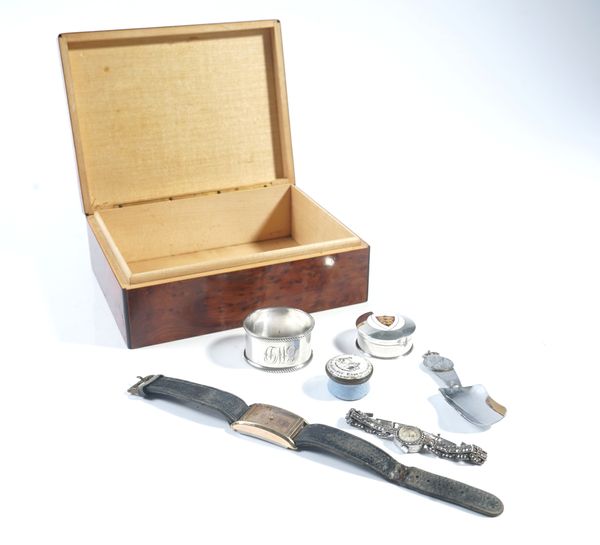 A SILVER & ENAMEL PILL BOX, A BILSTON ENAMEL PILL BOX, TWO WATCHES A CADDY SPOON AND A NAPKIN RING IN A BURR WOOD BOX