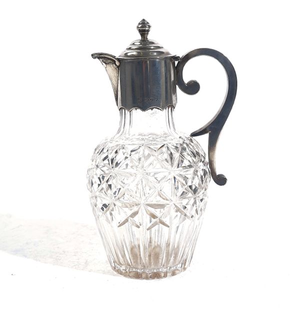 A VICTORIAN SILVER MOUNTED FACETED GLASS CLARET JUG