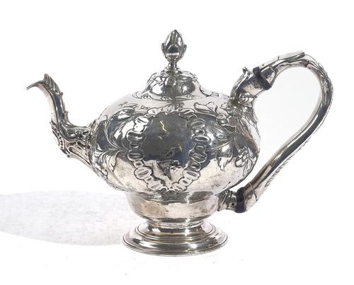 AN EARLY GEORGE III SILVER TEAPOT