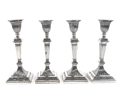 A SET OF FOUR VICTORIAN CANDLESTICKS  (4)