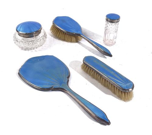 A FIVE PIECE SILVER AND BLUE ENAMEL PART DRESSING SET (5)