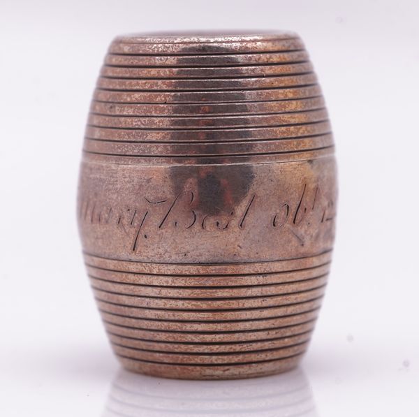 A SILVER NUTMEG GRATER FORMED AS A BARREL