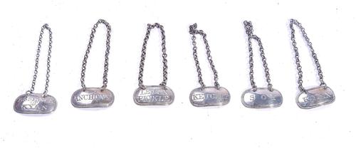 A SET OF SIX SILVER SAUCE LABELS (6)