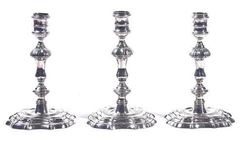 A PAIR OF AND ONE FURTHER GEORGE II SILVER CANDLESTICKS (3)