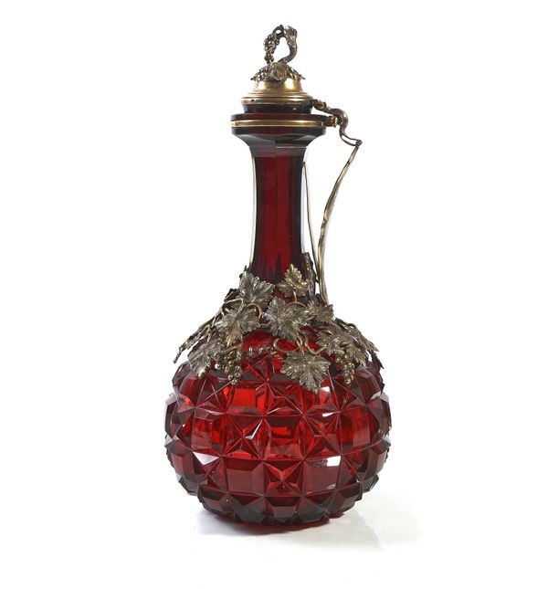 A VICTORIAN SILVER-GILT MOUNTED FACETED RED GLASS CLARET JUG