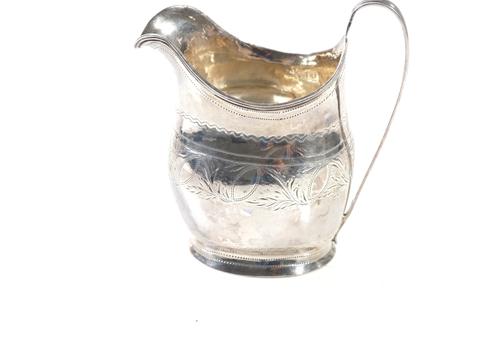 A GEORGE III SILVER MILK JUG