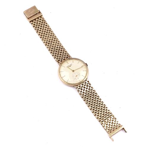 A 14K GOLD LONGINES GENTLEMAN'S BRACELET WRISTWATCH