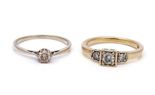 TWO 9CT GOLD AND DIAMOND RINGS (2)