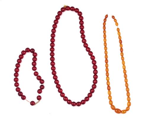 THREE AMBER BEAD NECKLACES (3)