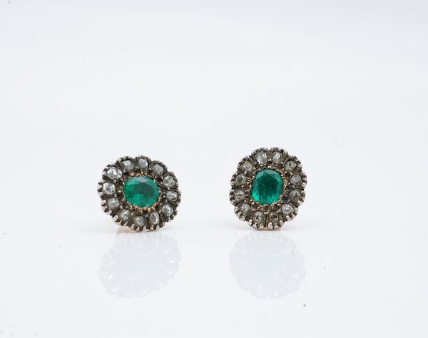 A PAIR OF DIAMOND AND EMERALD SET FOIL BACKED CLUSTER EARRINGS