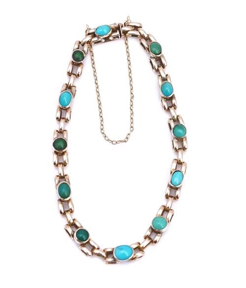 A GOLD AND TURQUOISE BRACELET