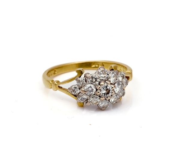 AN 18CT GOLD AND DIAMOND CLUSTER RING
