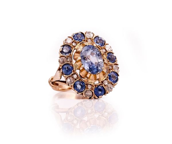 A SAPPHIRE AND DIAMOND OVAL CLUSTER RING