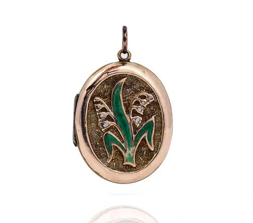 A VICTORIAN ENAMELLED OVAL PENDANT LOCKET