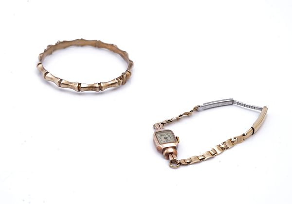 A 9CT GOLD BANGLE AND A LADY'S WRISTWATCH (2)