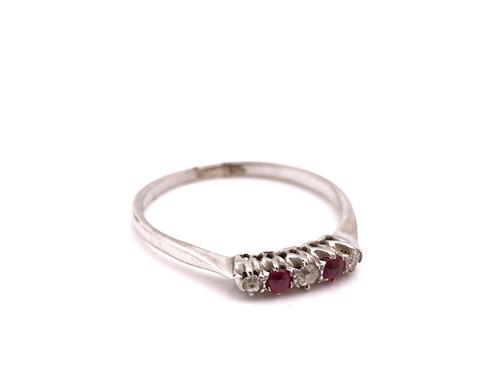 A RUBY AND DIAMOND FIVE STONE RING