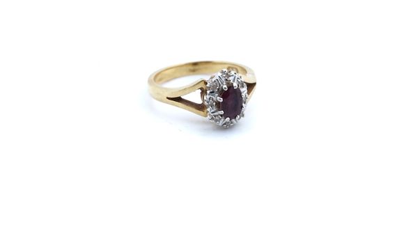 AN 18CT GOLD, RUBY AND DIAMOND OVAL CLUSTER RING