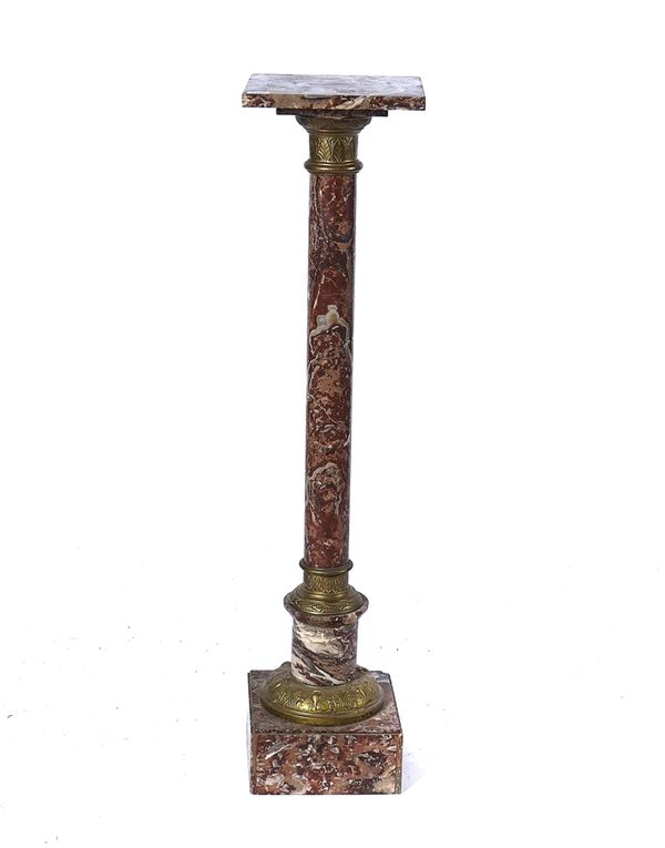 A FRENCH GILT METAL MOUNTED GRIOTTE MARBLE TORCHERE