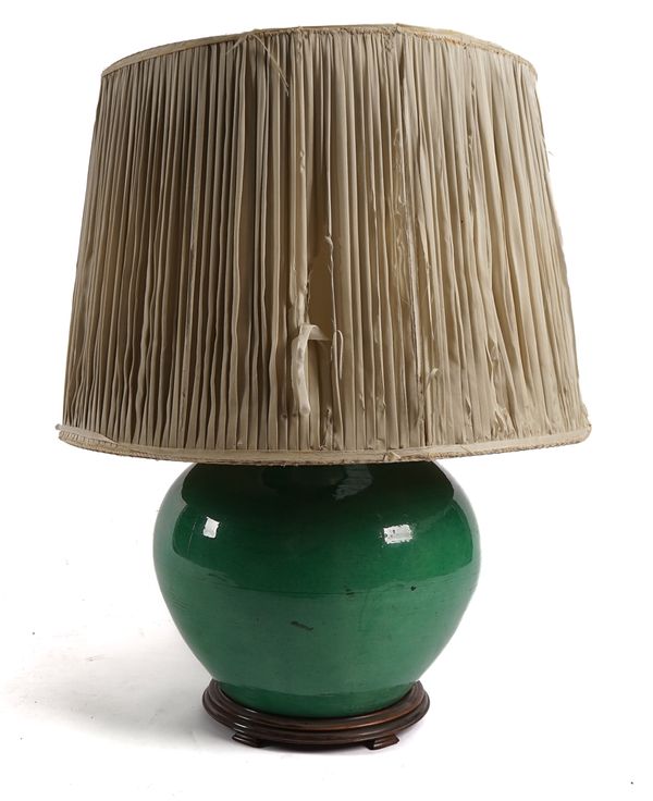 A LARGE GREEN GLAZED POTTERY LAMP