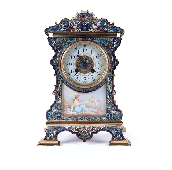 A FRENCH BRASS AND CHAMPLEVE ENAMEL MANTEL CLOCK