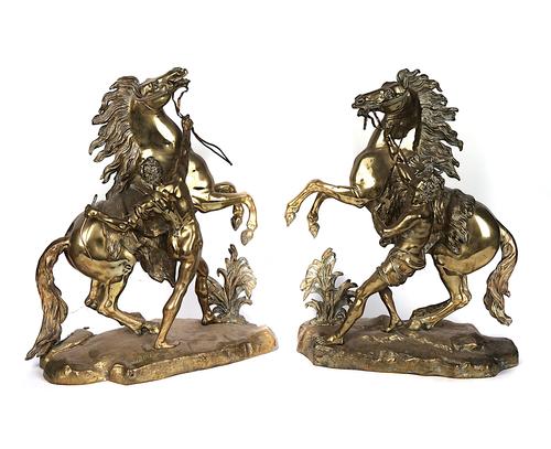 A PAIR OF POLISHED BRASS MARLY HORSES (2)