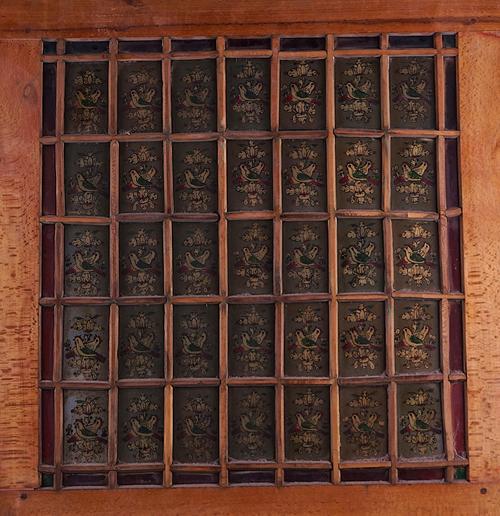 A TWO INDO-PERSIAN PAINTED AND STAINED GLASS WINDOW PANELS (4)