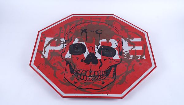 AN INCOMPLETE SINGING STOP SIGN; REFLECTIVE TAPE AND SILK-SCREEN ON METAL WITH BULLET HOLES