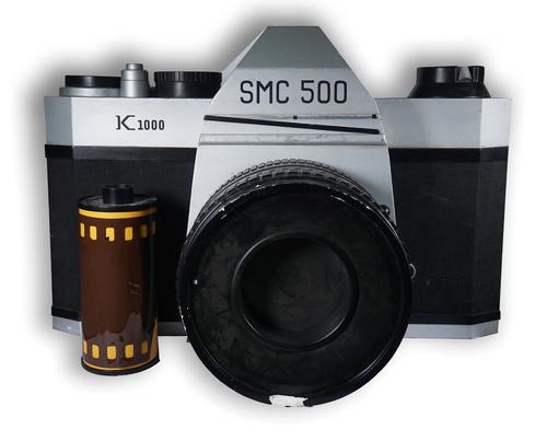 SIMON COSTIN; A LARGE WOOD, FIBREGLASS AND PLEXIGLASS MODEL OF A A SMC 500 PENTAX CAMERA, TOGETHER WITH A FIBREGLASS MODEL OF A KODAK ROLL OF FILM (2)