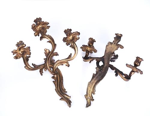 A PAIR OF ROCOCO STYLE GILT-METAL THREE-LIGHT WALL APPLIQUÉS