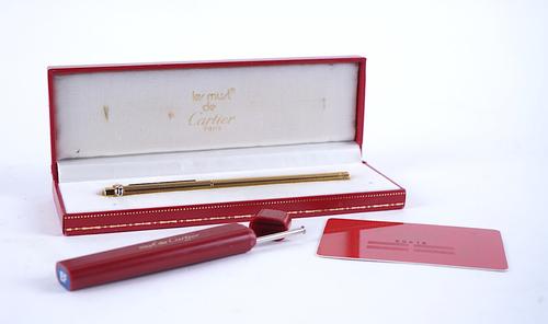 A CARTIER GOLD PLATED PEN