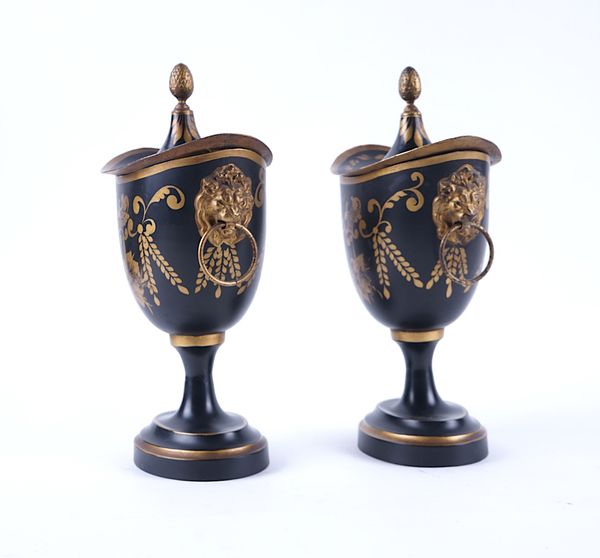 A PAIR OF REGENCY STYLE PARCEL-GILT DECORATED TOLEWARE CHESTNUT URNS AND COVERS