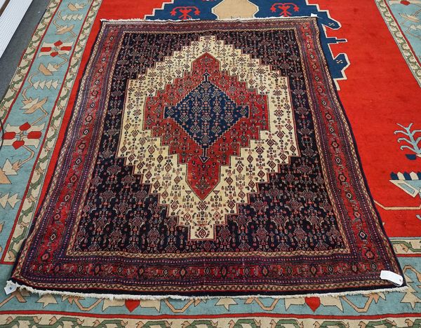 A SENNEH CARPET PERSIAN