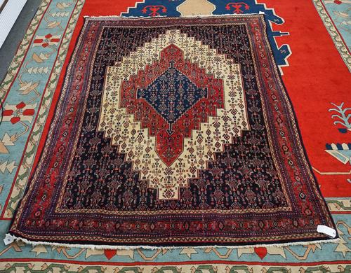 A SENNEH CARPET PERSIAN