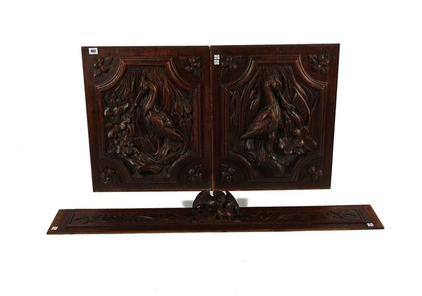 A PAIR OF CARVED OAK WALL PANELS DECORATED WITH HO-HO BIRDS (3)