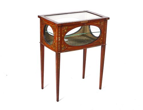 AN EDWARDIAN FLORAL POLYCHROME PAINTED SATINWOOD BIJOUTERIE CABINET