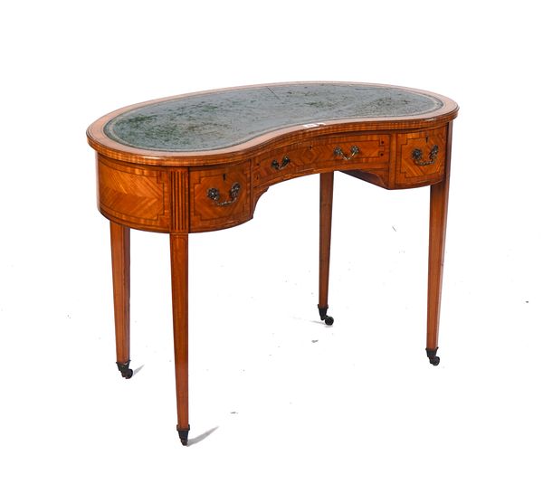 A LATE VICTORIAN SATINWOOD KIDNEY SHAPED WRITING DESK
