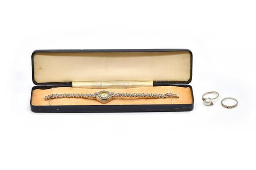 A WHITE GOLD, CULTURED PEARL AND DIAMOND RING, ANOTHER DIAMOND RING AND A LADY'S SILVER AND MARCASITE BRACELET WRISTWATCH (3)