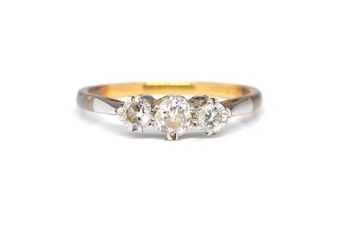 A GOLD AND PLATINUM, DIAMOND THREE STONE RING