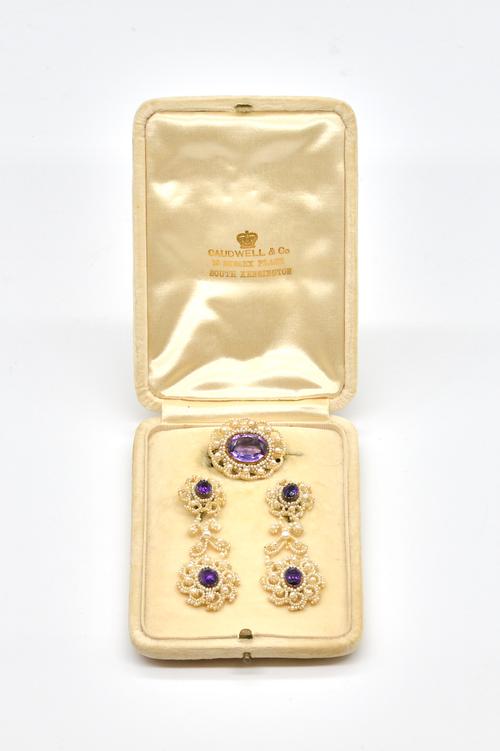 AN AMETHYST AND SEED PEARL PAIR OF EARRINGS AND A  MATCHING BROOCH