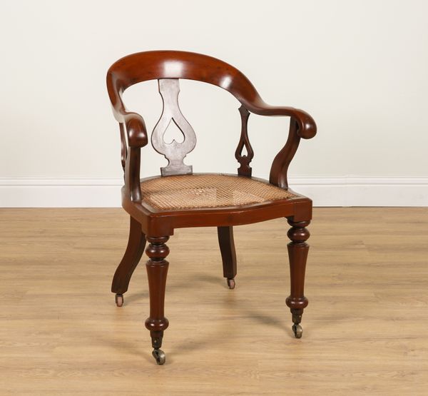 A 19TH CENTURY MAHOGANY FRAMED TUB BACK DESK CHAIR