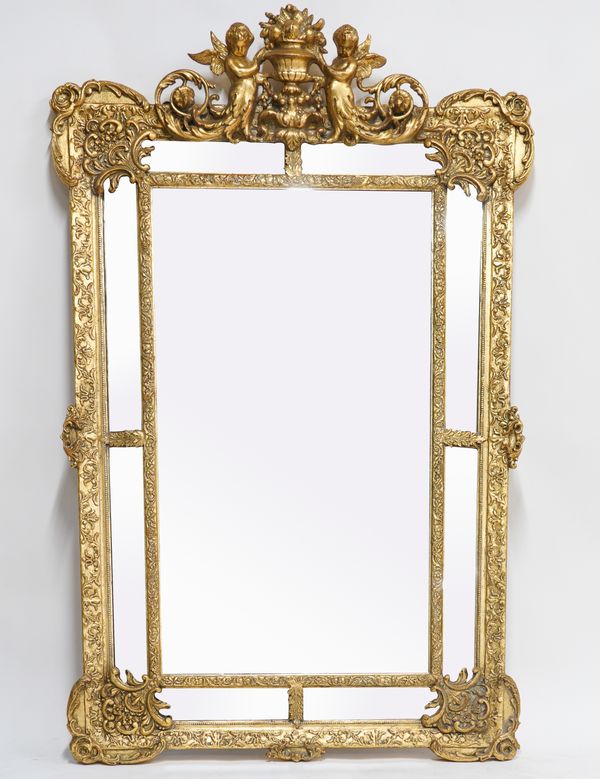 A 20TH CENTURY GILT PAINTED MARGINAL WALL MIRROR WITH WINGED CHERUB SURMOUNT