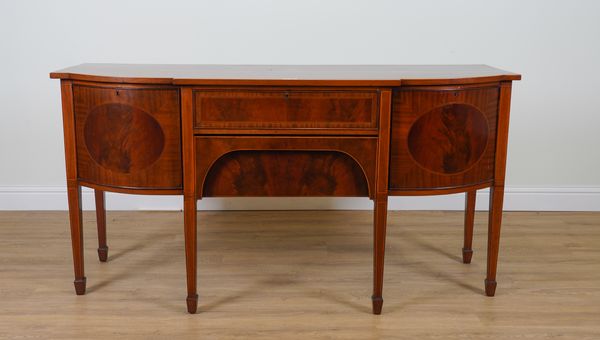 A GEORGE III STYLE INLAID MAHOGANY BREAKFRONT SIDEBOARD