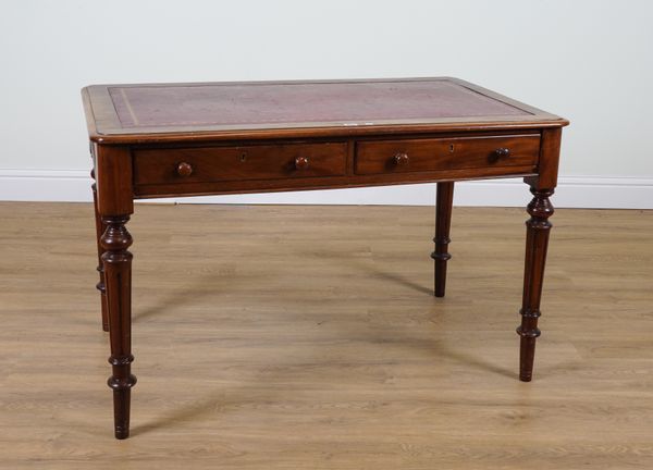 A VICTORIAN MAHOGANY TWO DRAWER WRITING TABLE