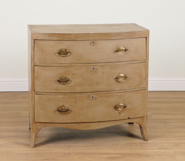 A REGENCY LATER PAINTED BOW FRONT THREE DRAWER CHEST